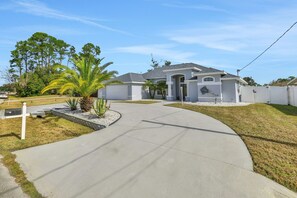 Exterior - Contemporary coastal escape with heated pool, fenced yard, & outdoor dining (Palm Coast)