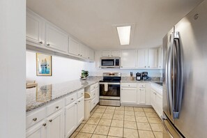 Fridge, microwave, oven, stovetop - Oceanfront condo with private balcony, shared pool and beach access (Fernandina Beach)