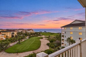 A golf course with a view of the ocean and a residential area with multiple buildings. - Dog-friendly condo on the golf course with ocean view, pools, gym & beach access (Palm Coast)