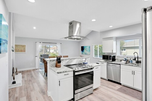 Elegant sound view home with enclosed pool, dock, pool table, fireplace, & grill