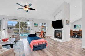 TV, fireplace, books