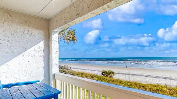A covered outdoor area with a view of a beach. - Oceanfront rental with amazing views, beach access, pools, tennis & pickleball (St. Augustine)