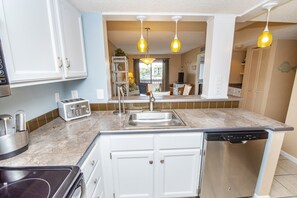 Fridge, microwave, oven, stovetop - Lovely Oceanside Home w/Outdoor Shower/Free WiFi/Shared Pool/Hot Tub/Tennis/AC (St. Augustine)