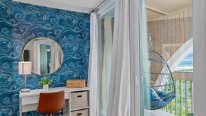 A room with a desk, chair, and a large window with a view of the ocean. - Lovely ocean-view condo with pools, hot tubs, private W/D, & central AC (St. Augustine)