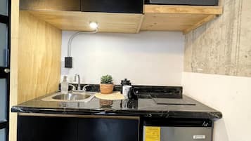 Mini-fridge, microwave, stovetop, cookware/dishes/utensils