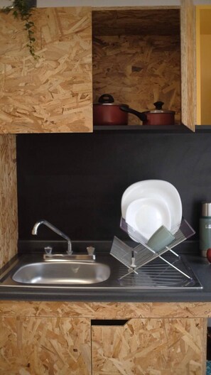 Economy Studio, 1 Twin Bed | Private kitchen | Microwave, stovetop, cookware/dishes/utensils