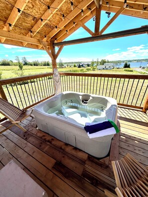 Outdoor spa tub - Coastal Charm Meets Country Calm | Relaxing Cottage with Water Views & Hot Tub (Cocagne)