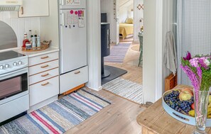 Fridge, stovetop, dishwasher, coffee/tea maker