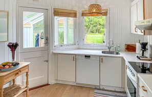 Fridge, stovetop, dishwasher, coffee/tea maker