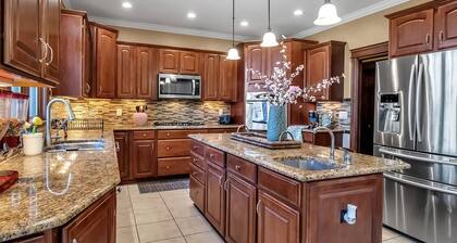 Lakeside 4-Bedroom Retreat with Kids’ Play Area & EV Charger