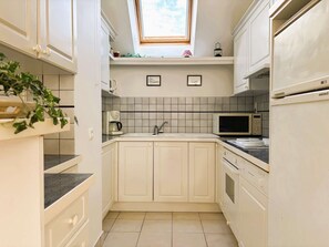 Réfrigérateur, four, lave-vaisselle, grille-pain