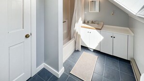 A bathroom with a bathtub, a shower, a sink, and a mirror. - Hidden Kingdom | Near Echo Lake, Private Retreat w/ Outdoor Space (Plymouth)