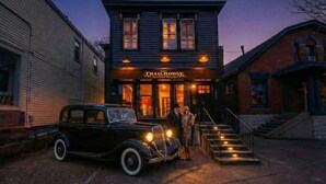A building with a sign reading "The Trailhouse." - *New* Speakeasy Highlands 7BR | Hot Tub | Sleep 14 (Louisville)