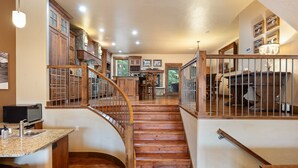 A spacious kitchen with wooden cabinets, a granite countertop, and a built-in microwave. - Ski In Out Villa 464 I Private Hot Tub I Great Views I Outdoor Fireplace I Discounted Attractions (Winter Park)