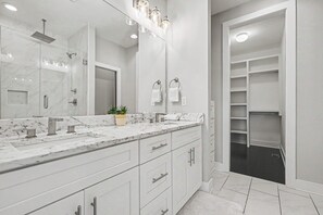 Shower, hair dryer, towels, shampoo