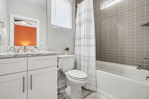Shower, hair dryer, towels, shampoo