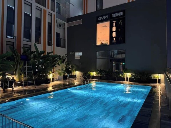 Outdoor pool, open 6:00 AM to 10:00 AM, pool umbrellas, pool loungers