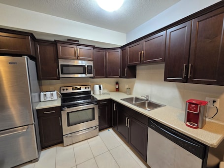Microwave, dishwasher. Cozy Basement Suite • Private Entry •Fort McMurray