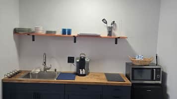 Fridge, microwave, stovetop, coffee/tea maker