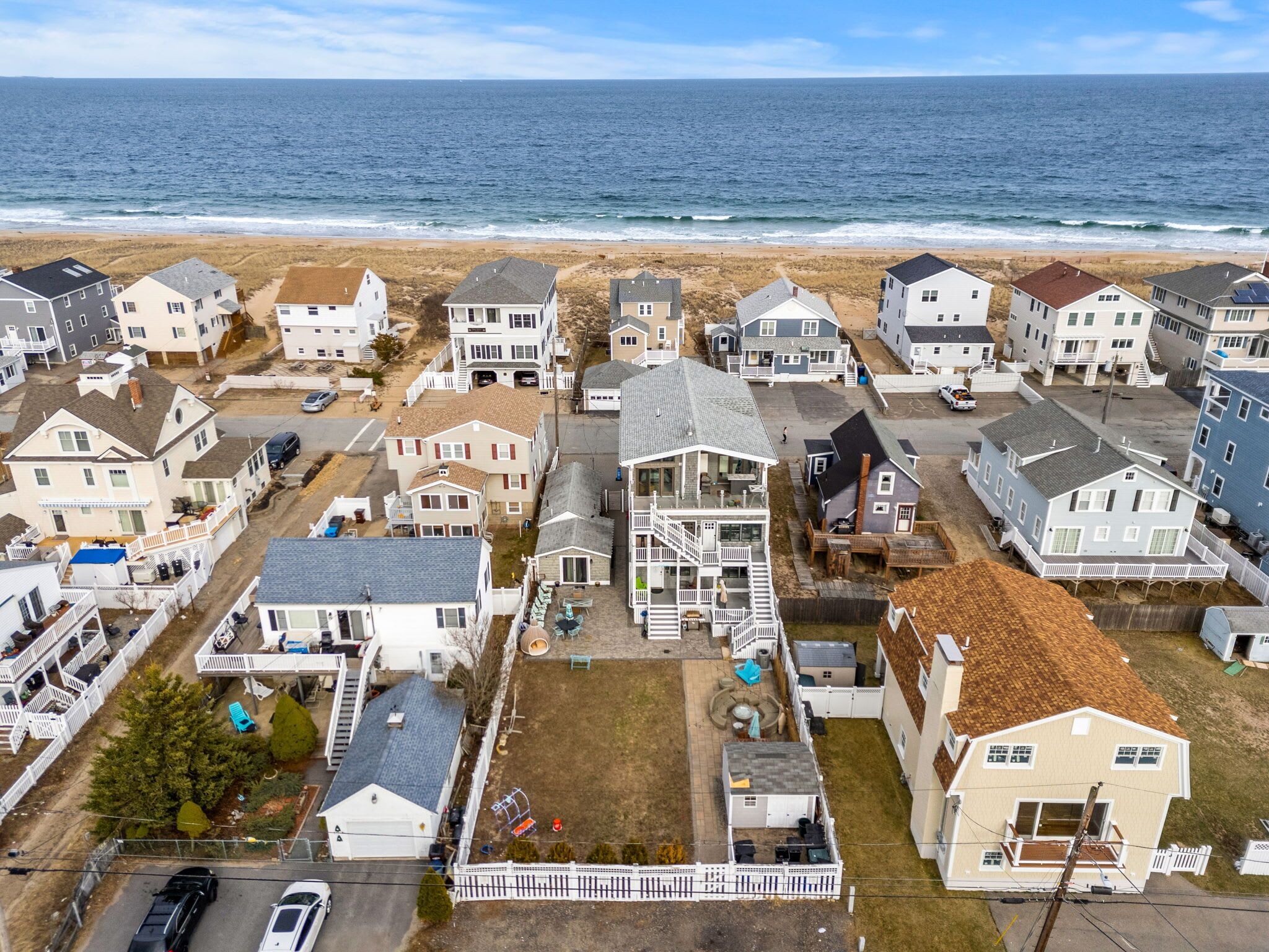 Aerial view of the home! Just steps to the beach via a private beach access. The backyard space is shared with other units on the property