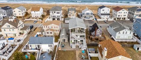 Aerial view of the home! Just steps to the beach via a private beach access. The backyard space is shared with other units on the property
