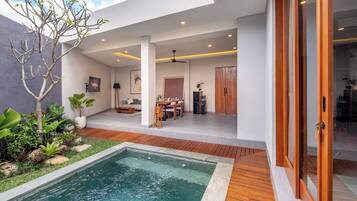 GRAND 1-Bedroom Pool Villa | Living area | 42-inch flat-screen TV with digital channels, Netflix
