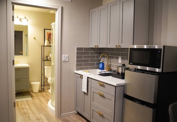 Fridge, microwave, stovetop, coffee/tea maker