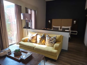 Suite | In-room safe, desk, laptop workspace, blackout drapes