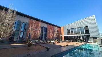 Outdoor pool, pool umbrellas, pool loungers