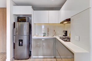 Fridge, microwave, stovetop, coffee/tea maker