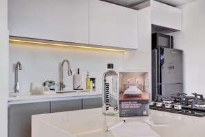 Fridge, microwave, stovetop, coffee/tea maker