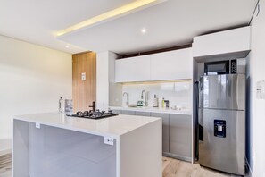 Fridge, microwave, stovetop, coffee/tea maker