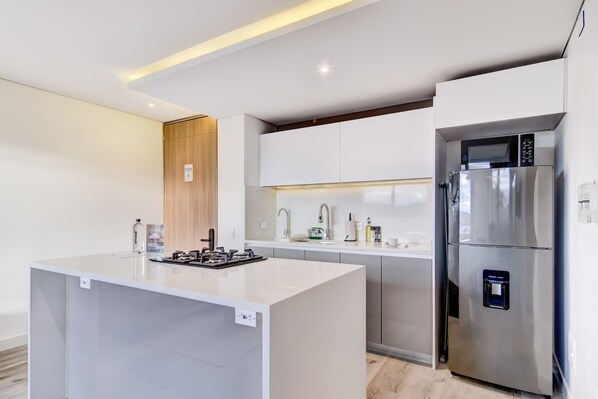 Fridge, microwave, stovetop, coffee/tea maker