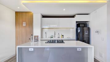 Fridge, microwave, stovetop, coffee/tea maker