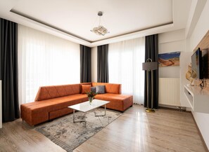 Deluxe Apartment, Balcony | Living area