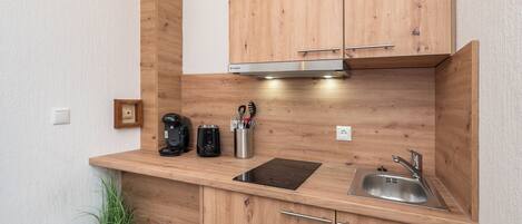 Fridge, stovetop, coffee/tea maker, cookware/dishes/utensils