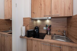 Fridge, stovetop, coffee/tea maker, cookware/dishes/utensils