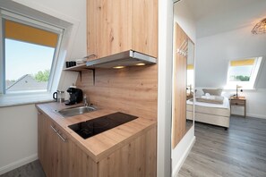 Fridge, stovetop, coffee/tea maker, cookware/dishes/utensils