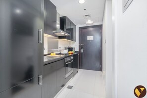 Luxury Studio, Balcony, City View | Iron/ironing board, free WiFi