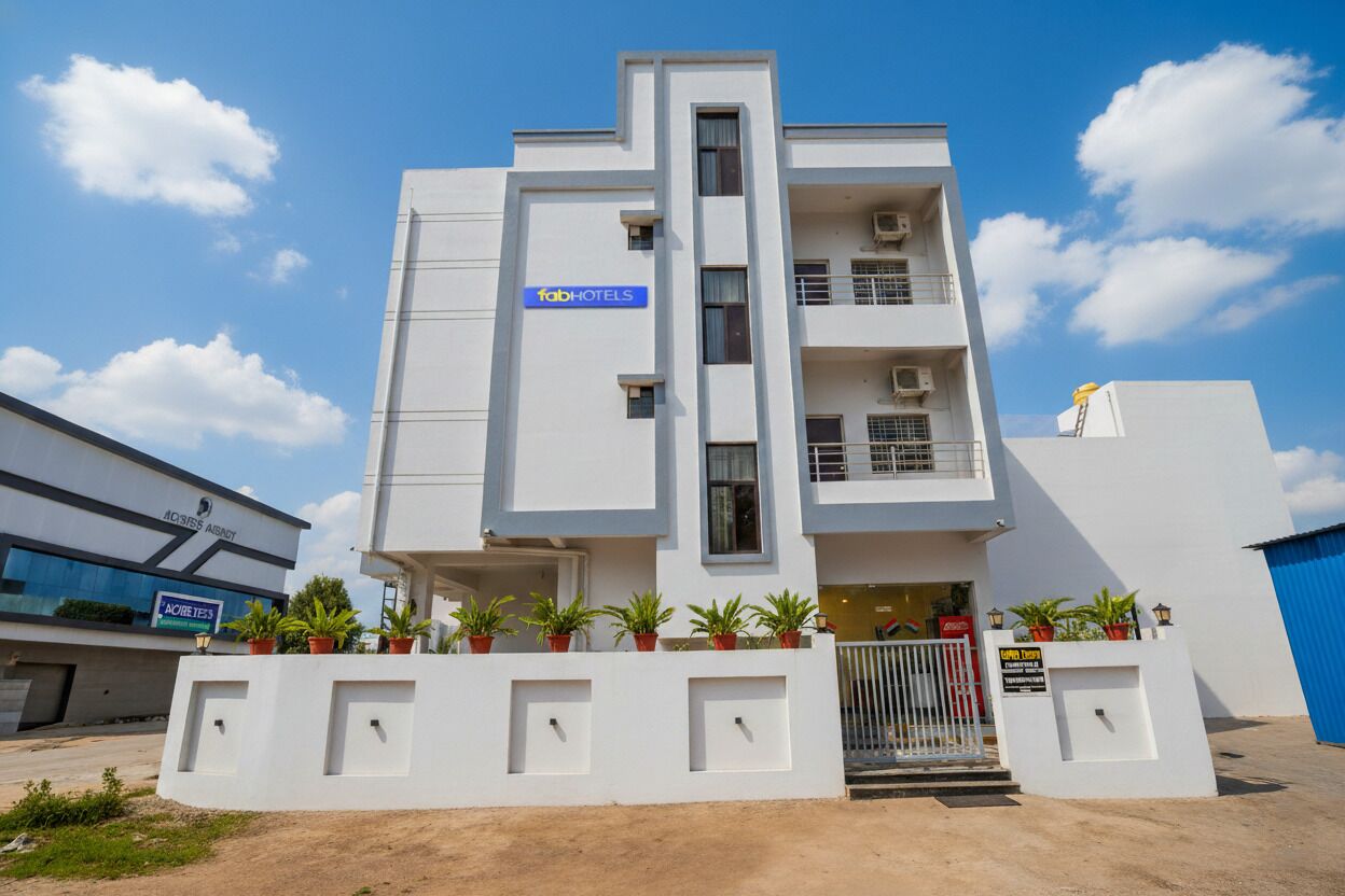 A modern building with a sign for 'fabHOTELS' on the facade.
