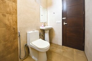 Habitación Deluxe | Baño | Ducha y cabezal de ducha tipo lluvia
