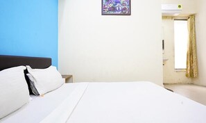 Egyptian cotton sheets, premium bedding, in-room safe, free WiFi - Fabhotel Infinity Rooms & Banquet (Surat)