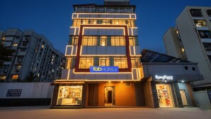 A modern hotel with a prominent 'fab hotels' sign, a glass entrance, and a 'Rang Razz' store on the ground floor. - Fabhotel New Pune Residency (Pune)