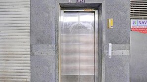 An elevator with a metallic interior and a sign above it that reads "LIFT-2". - Fabhotel Nova Rooms (Surat)