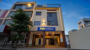 A modern building with a sign reading "fabHOTELS" at the entrance. - Fabhotel The Shloka (Bhopal)