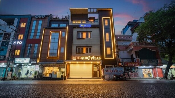 A hotel with a modern facade, multiple floors, and illuminated signage. - Fabhotel Shri Vilas (Bhopal)