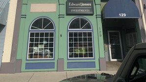 A building with a sign reading 'Madison Building' and 'Edward Jones Investments.' - Heron’s Perch - Uptown Port Clinton, Jet Express, 5 minute walk to Beach (Port Clinton)