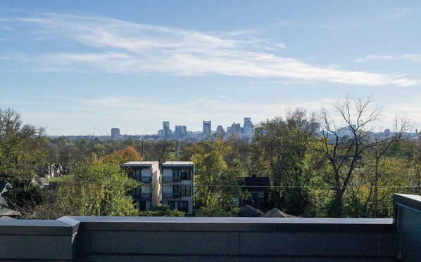 A city skyline with modern buildings and a clear sky.