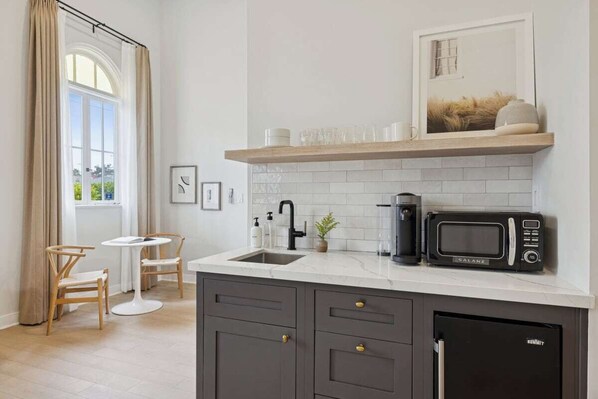 Fridge, microwave, coffee/tea maker, toaster