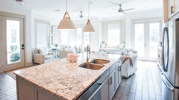 A modern kitchen with a marble countertop, double sink, and stainless steel appliances. - Tryin' To Catch A Good Time-30A Townhome with 6-Seater Golf Cart! Sleeps 8 (Santa Rosa Beach)